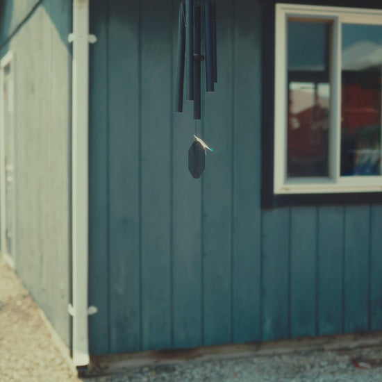 Video preview of the Whispers in the Wind series wind chimes, showcasing handcrafted, soft-toned chimes that produce delicate melodies. These Amish-made instruments feature weather-resistant black aluminum tubes and are ideal for small gardens and balconies.
